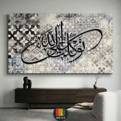 Modern horizontal canvas wall art featuring black Arabic calligraphy of 'Tawakal' over a grey and beige geometric tiled background in a luxury interior.