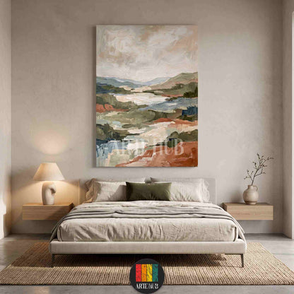 A large vertical abstract landscape canvas wall art with earthy terracotta and sage green tones hanging in a luxury modern bedroom in Egypt.