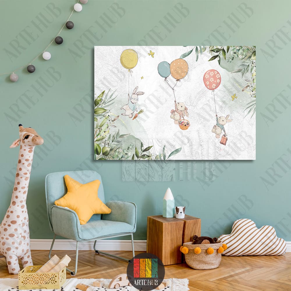 Watercolor style canvas wall art featuring three cute rabbits flying with colorful balloons and botanical leaves in a nursery setting.