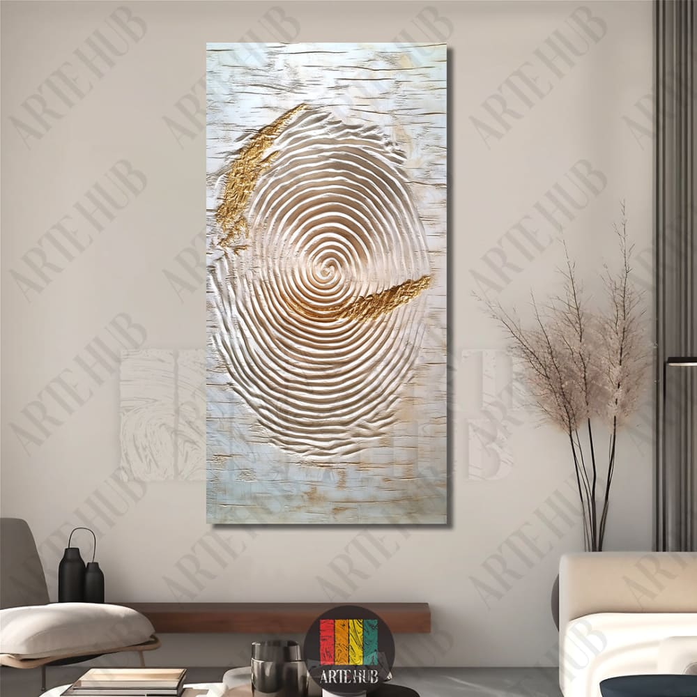 Modern abstract canvas wall art featuring concentric textured ripples with gold leaf accents and a central blue dot in a minimalist Egyptian living room.